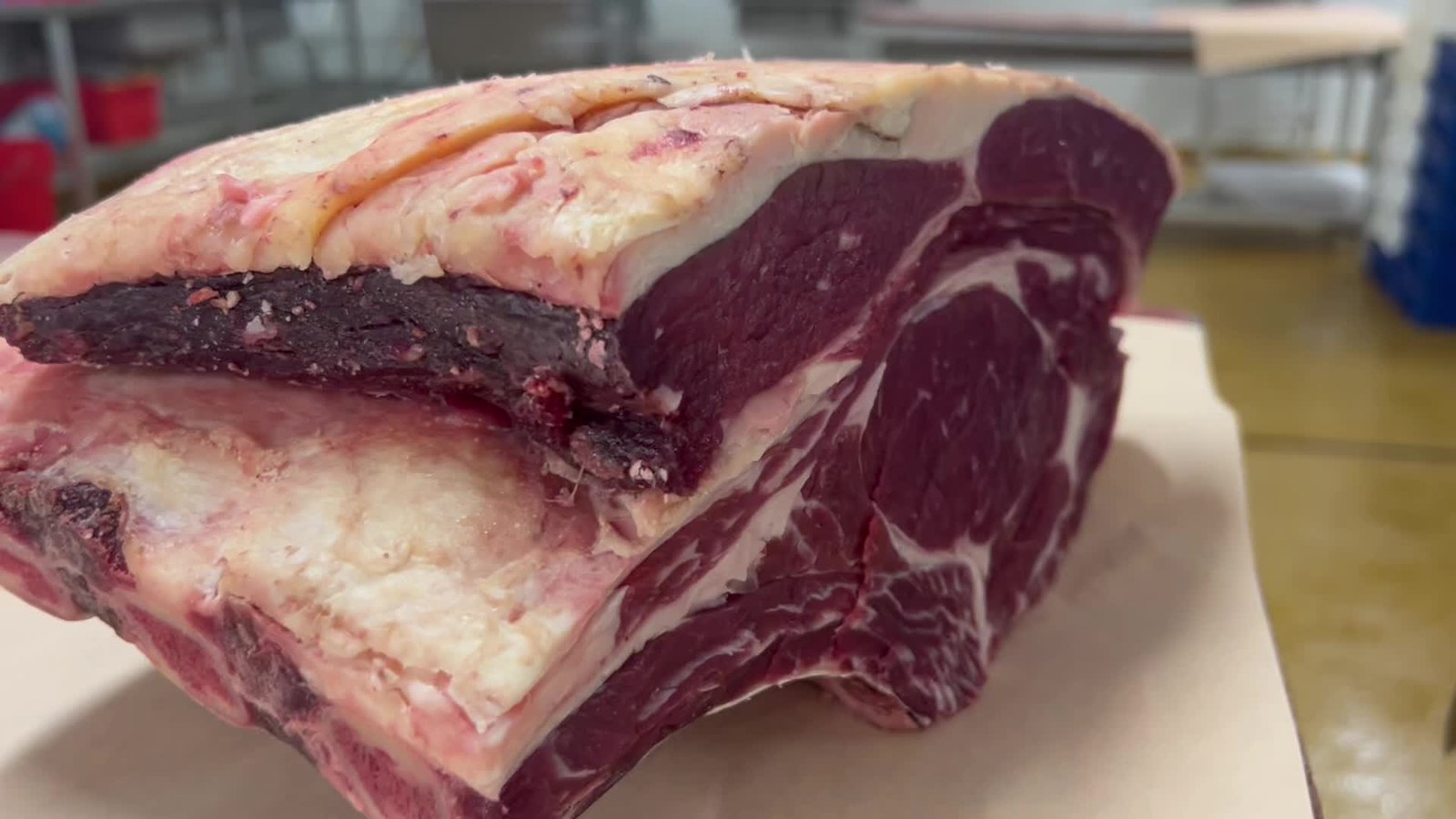 A beef joint being prepared at the Midland Foods cutting bench